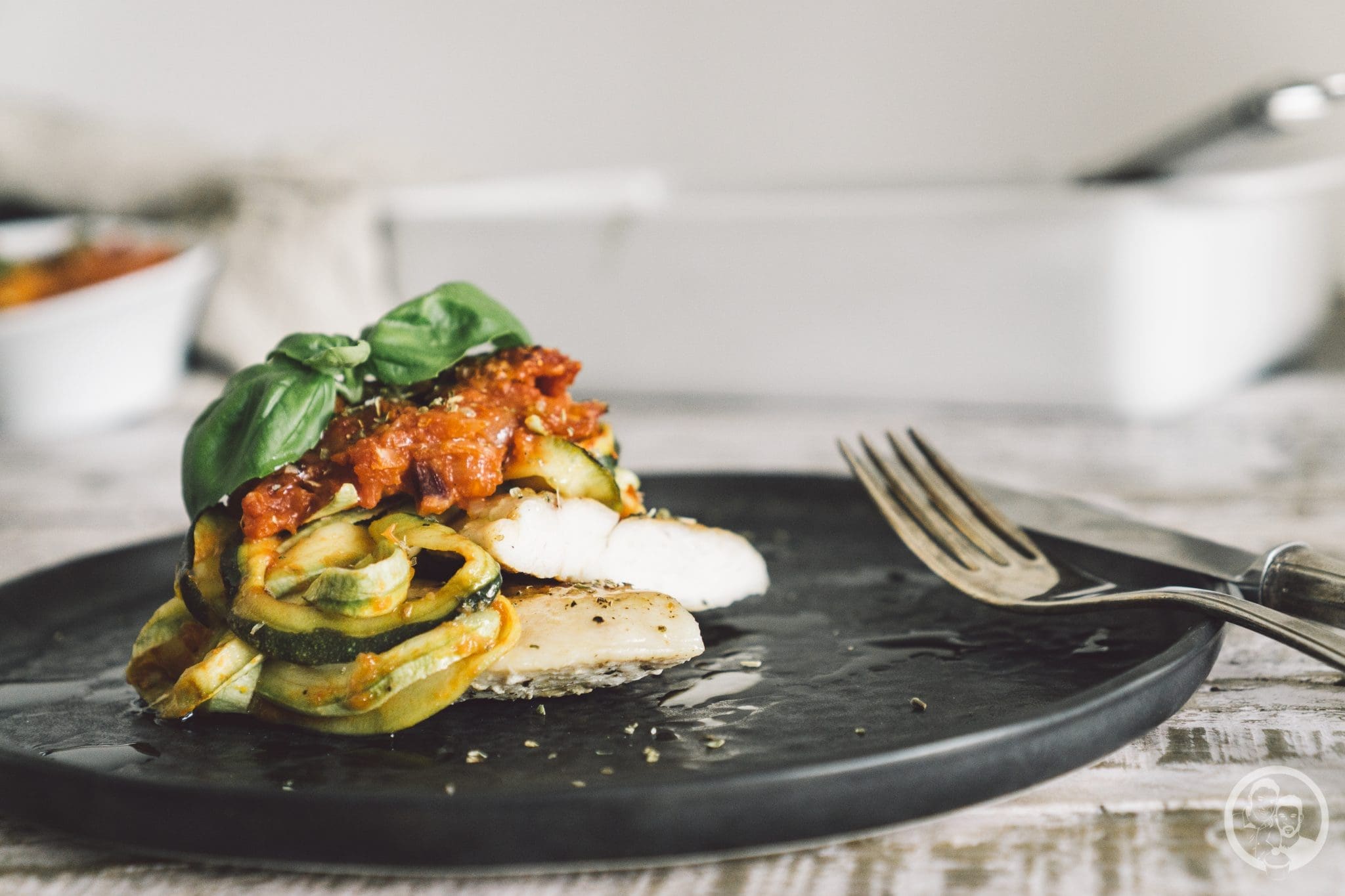 Pollo con zucchini alla parmigiana